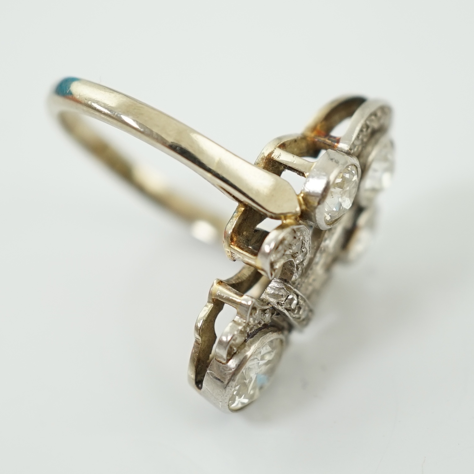 A 9ct white gold, platinum and diamond cluster set up-finger ring